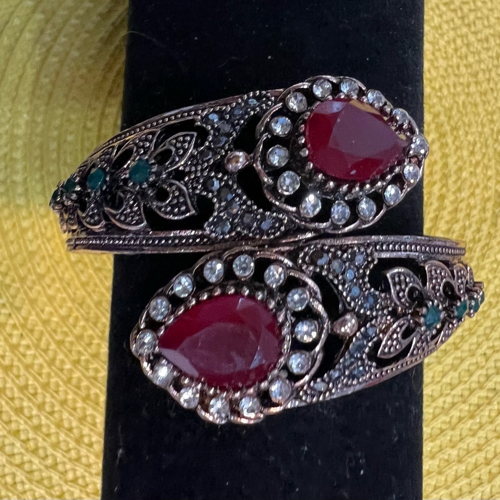 Striking Bypass Bracelet With Ruby Colored And Cl… - image 1
